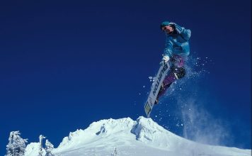 Kim Kardashian Shows Off Deep Cleavage In Plunging Top & Mini